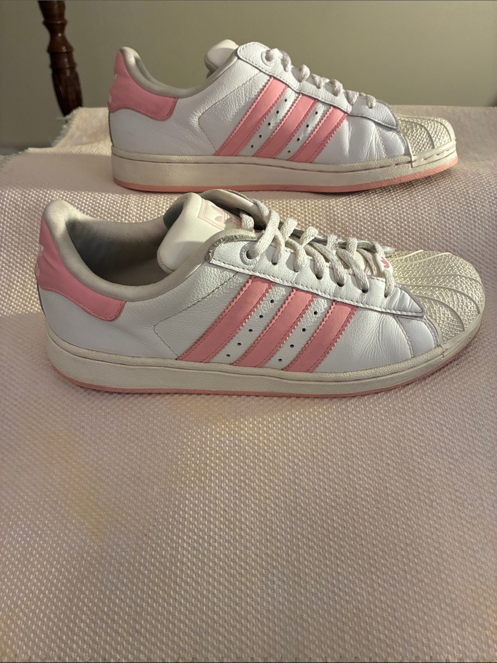adidas Superstar White & Pink Women's Low-Top Sneakers & rubber shell toe.